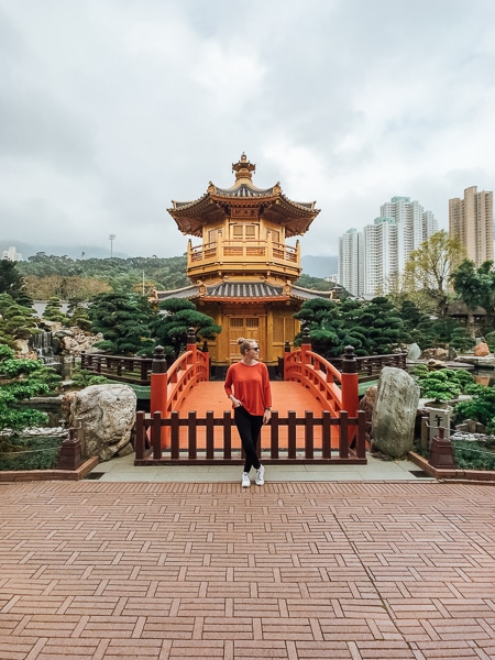 Girl standing in front of temple in Hong Kong