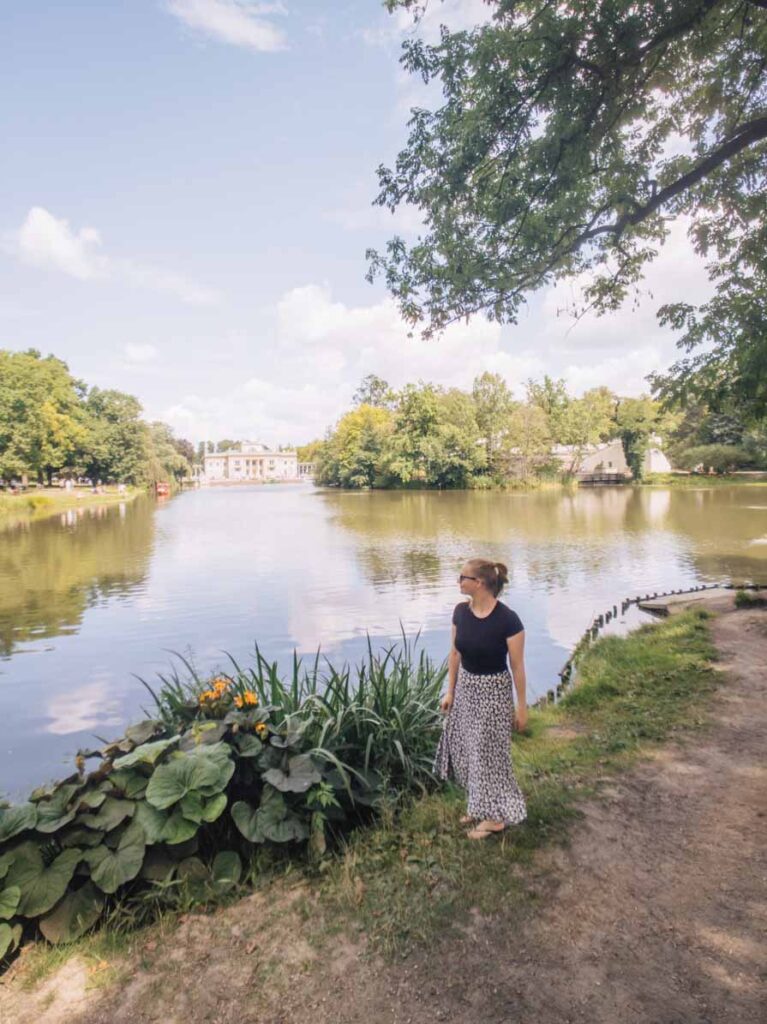 Girl by a lake at Lazienki Park in Warsaw