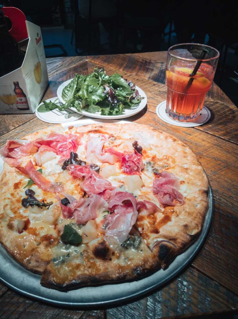 Pizza and iced tea at restaurant in Ghent, Belgium