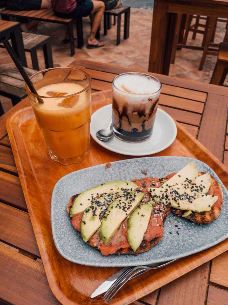 Avocado toast with orange juice and coffee in San Sebastian