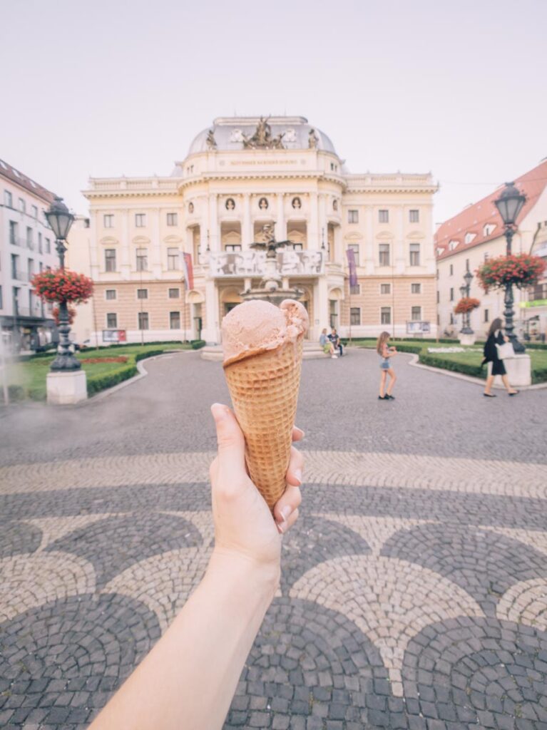 Ice cream in front of a building in Bratislava