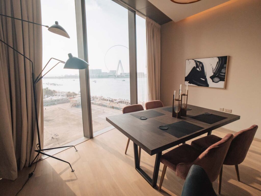 Dining table in apartment with view over Dubai beach