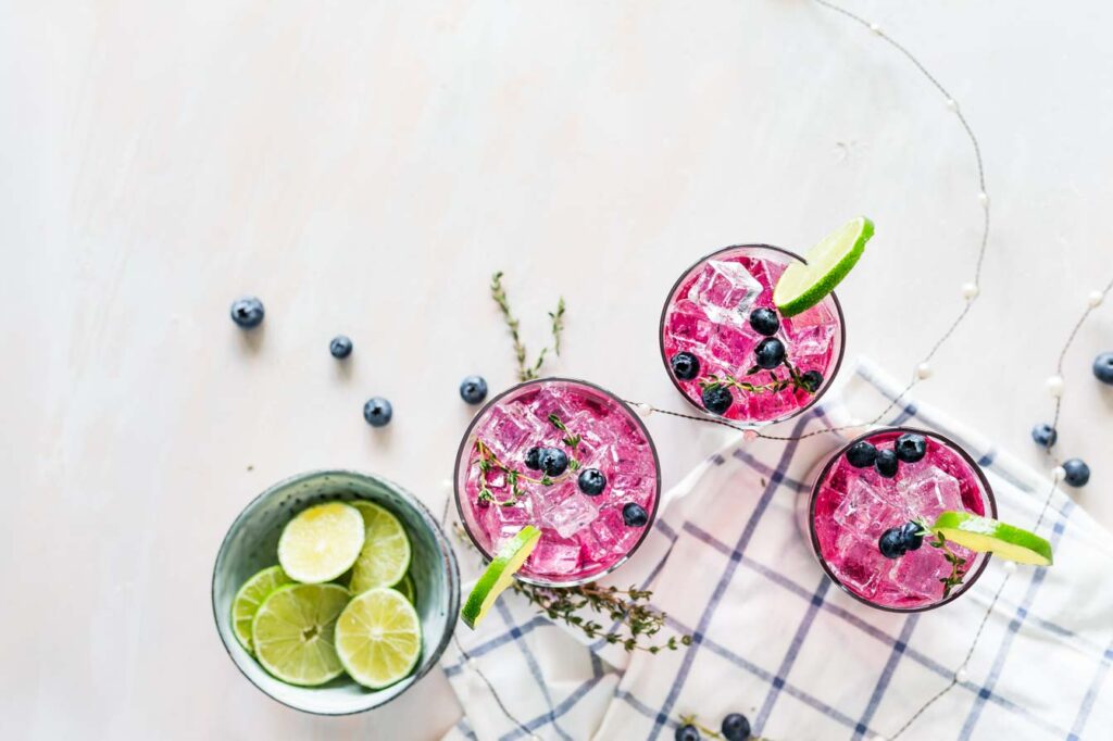 Pink smoothies with lime and blueberries