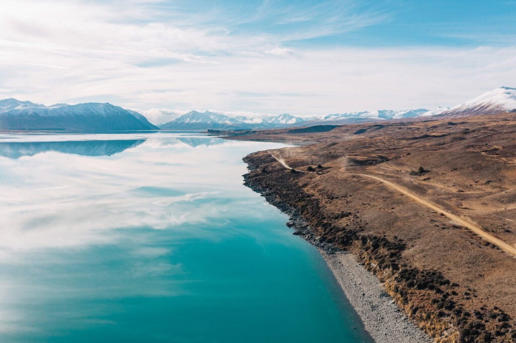 Aerial drone view of turquoise Lake Tekapo taken from Lilybank Road