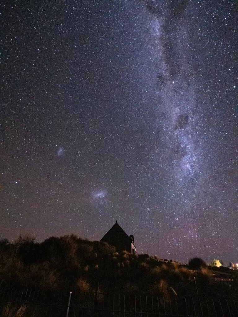 The Church of the Good Shepherd silhouetted beneath the Milky Way at Lake Tekapo, one of the top Tekapo highlights