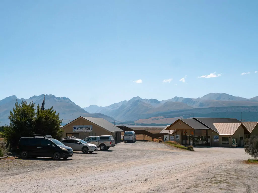 Glen Tanner accommodation buildings with mountain views and car park near Aoraki Mount Cook Village