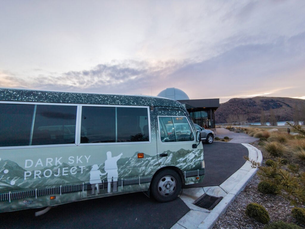 Dark Sky Project shuttle bus parked at the observatory, one of the must-do activities in Tekapo