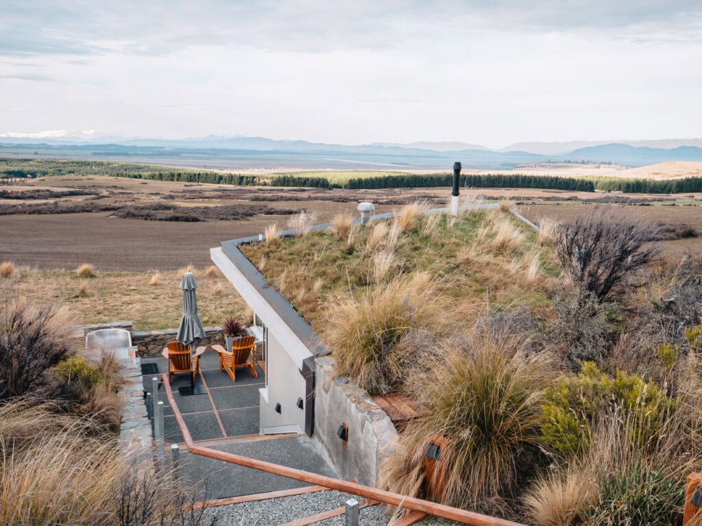 Outdoor deck with hot tub at a SkyScape cabin in Twizel overlooking the Mackenzie Basin
