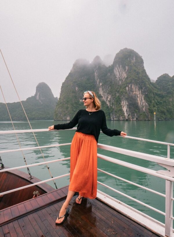 girl standing on deck of halong bay cruise boat