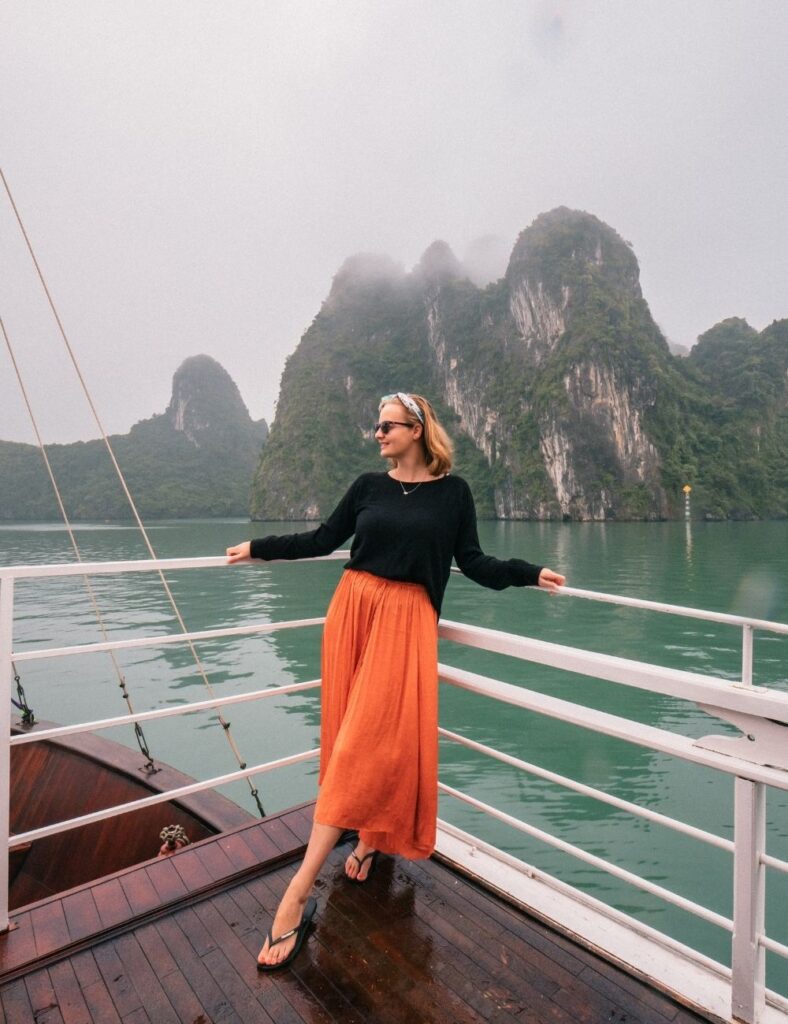 girl standing on deck of halong bay cruise boat