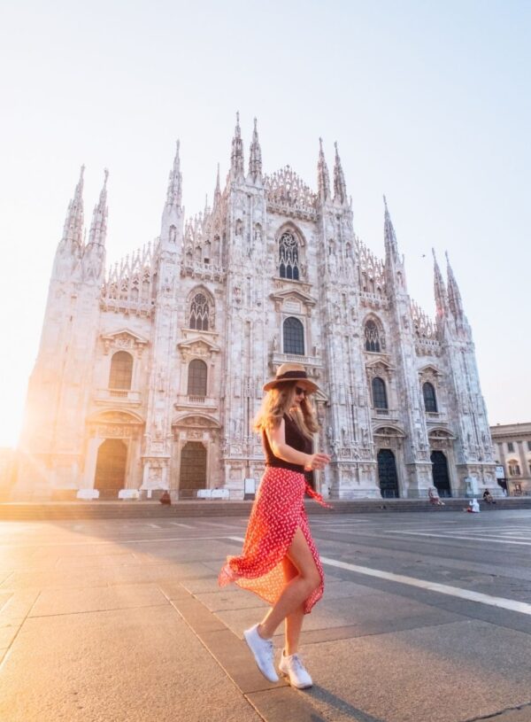 girl walking in front of duomo di milano