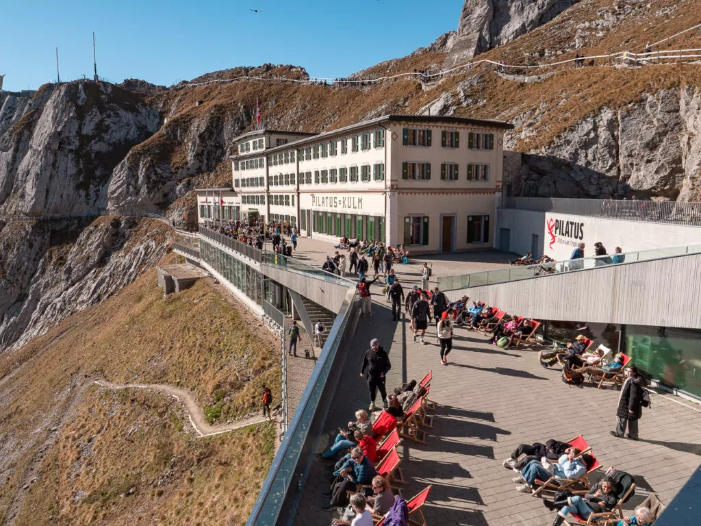 Tourists walking along the summit area at Mount Pilatus