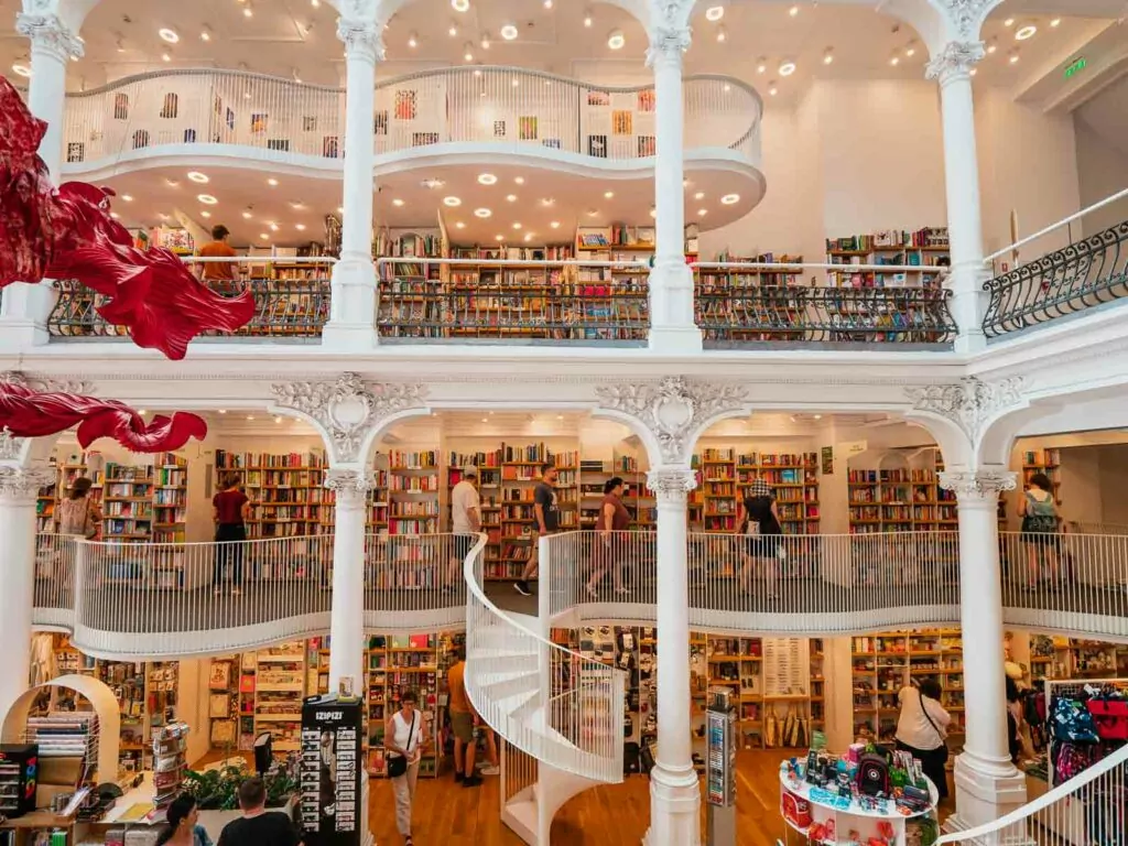 Interior view of Carturesti Carusel Bookshop in Bucharest, with its iconic spiral staircase, a must-visit spot on a 3 days in Bucharest itinerary