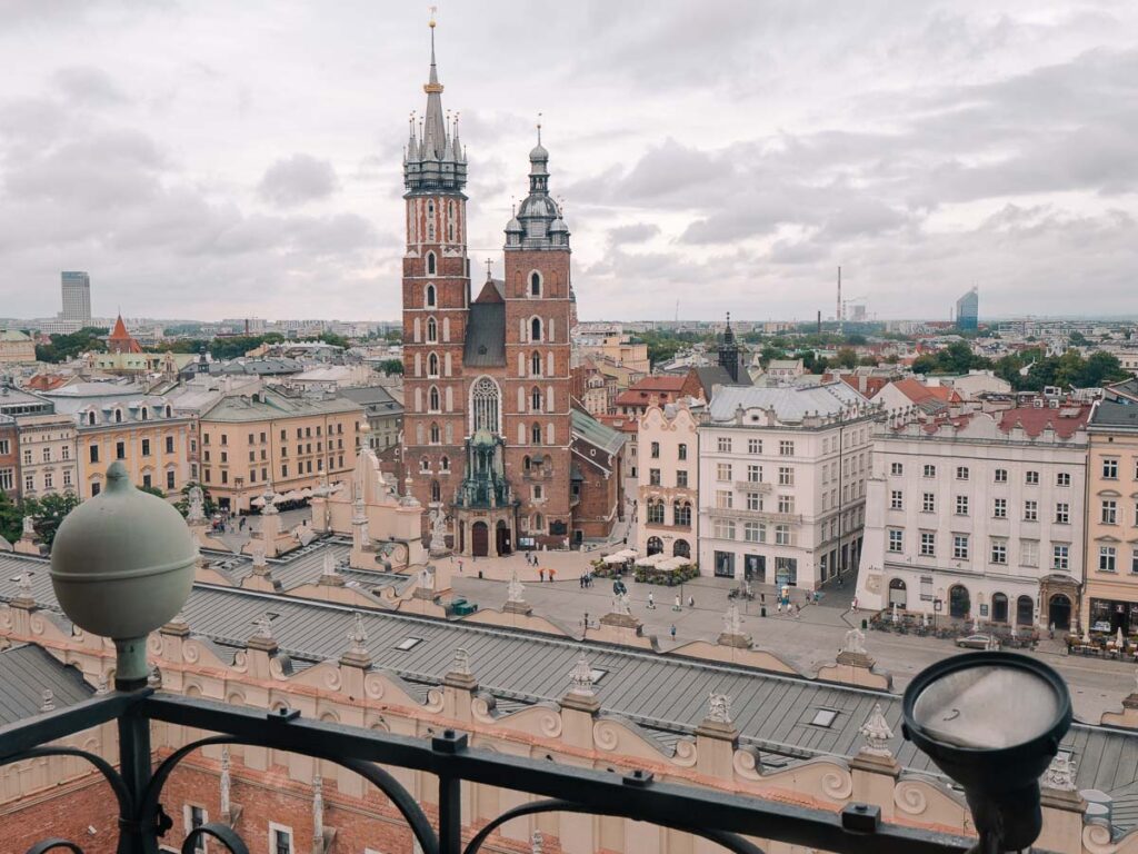 Overlooking Krakow's main square from the Town Hall Tower, the view captures the historical grandeur of St. Mary's Basilica and the surrounding architecture, a highlight during two weeks in Poland