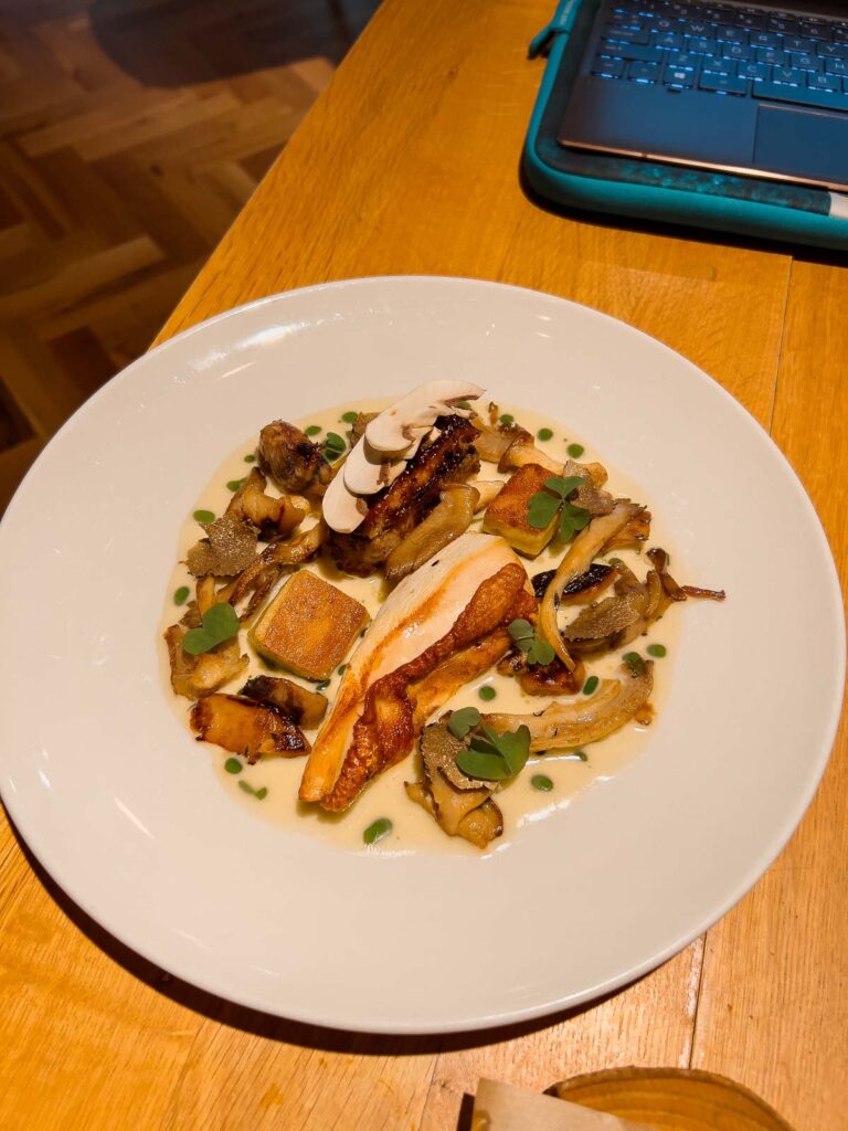 Gourmet chicken and truffle dish served at Cosmos restaurant, exemplifying the city's modern gastronomy for travellers exploring Sofia, Bulgaria