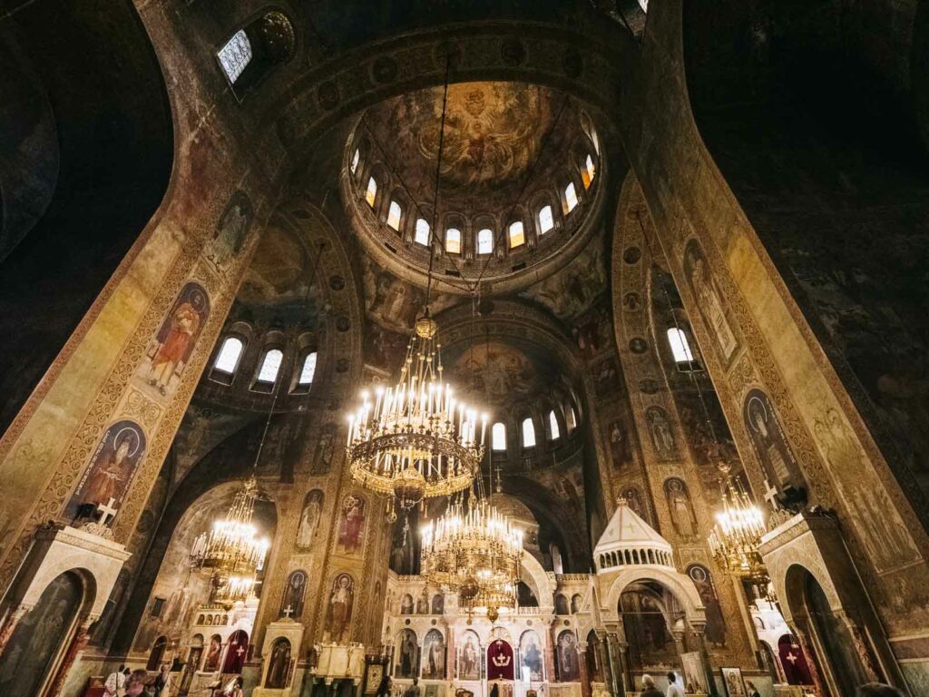 Majestic interior of Alexander Nevsky Cathedral with frescoes and chandeliers, a spiritual highlight for a 1 day in Sofia itinerary