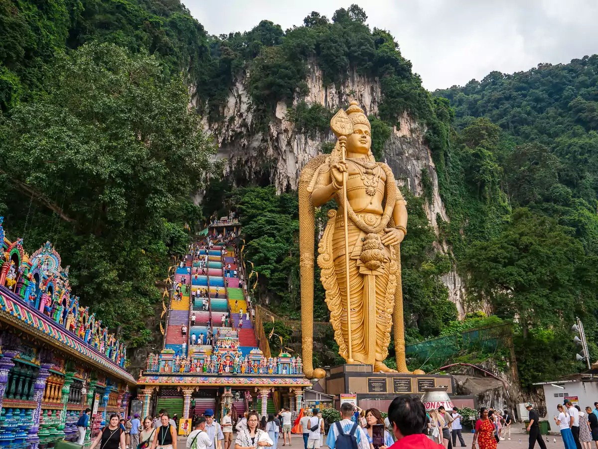 The iconic Batu Caves with the towering golden statue of Lord Murugan, a must-visit