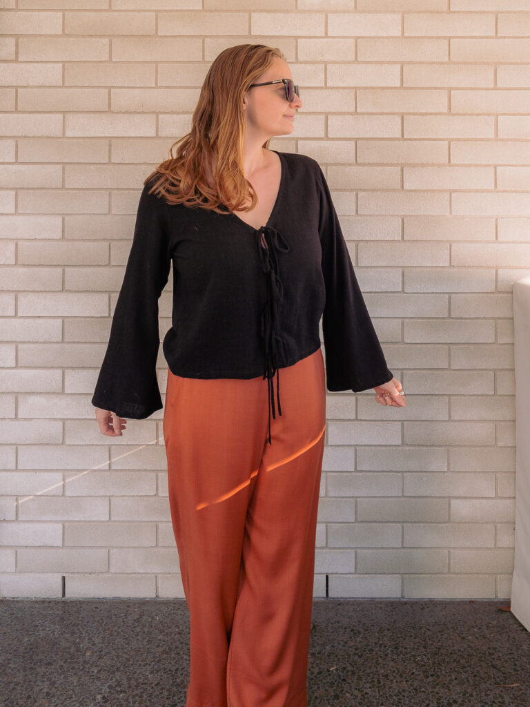Black bell sleeve top from I Choose tailor in Hoi An, worn with rust trousers