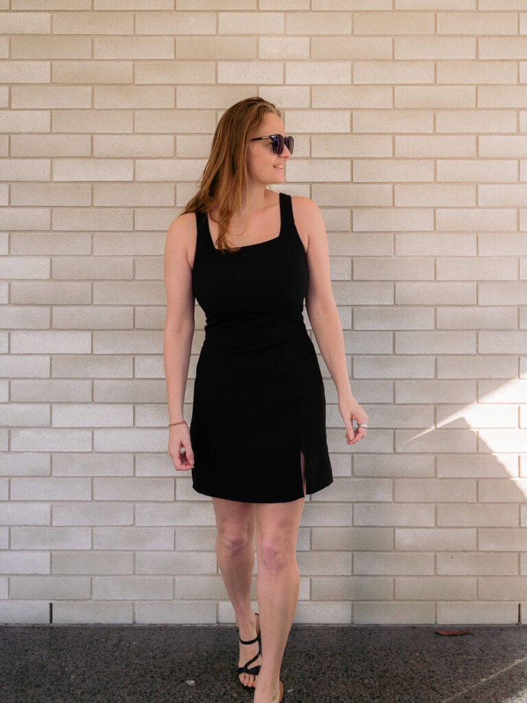 Black sleeveless mini dress with a front slit from Milan Linen tailor in Hoi An