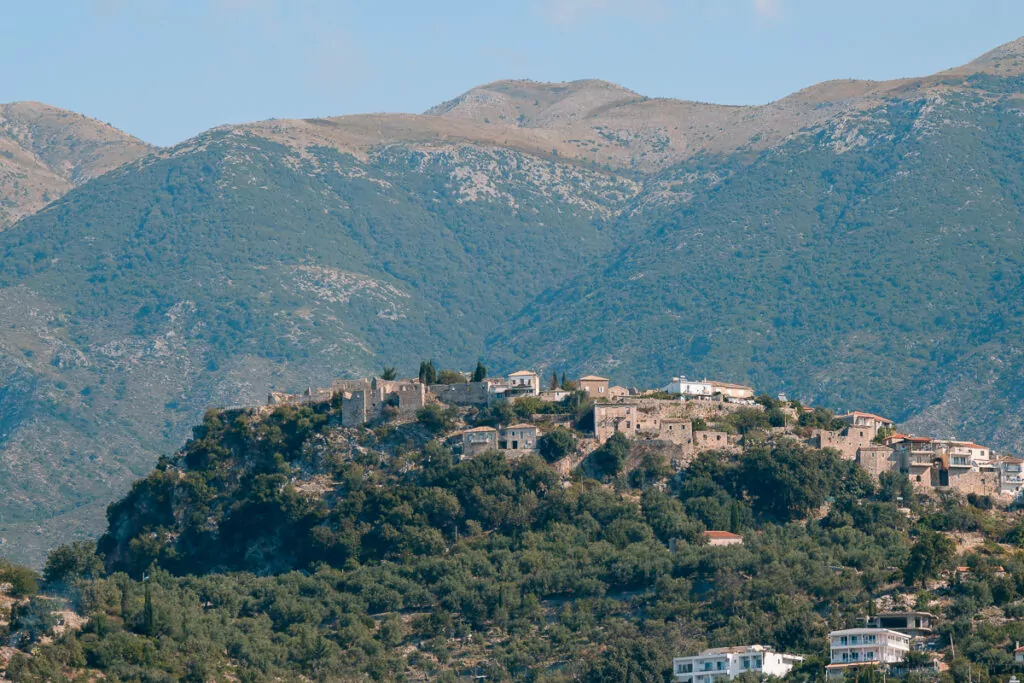 Dhermi, a traditional hillside village in southern Albania perches amongst the mountains, demonstrating authentic coastal settlements