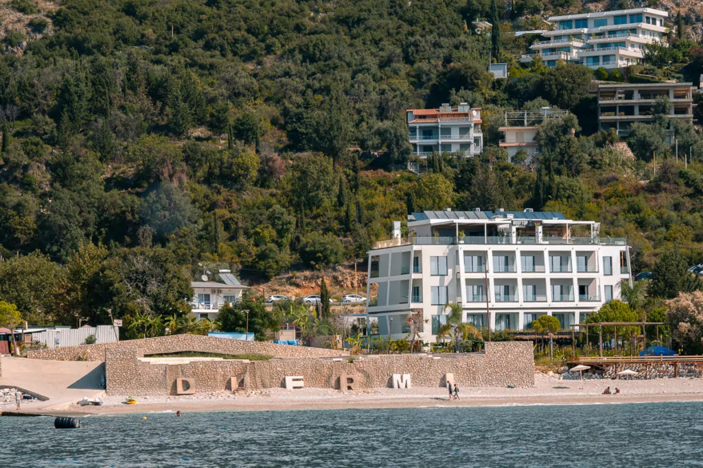 A modern beachfront hotel complex built into the Albanian hillside exemplifies rapid coastal construction