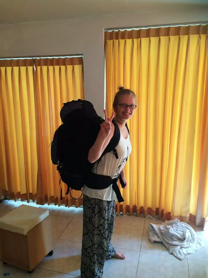 Alexx with a large backpack getting ready for her first ever trip to Asia in 2015 to explore Thailand, Cambodia and Vietnam with G Adventures