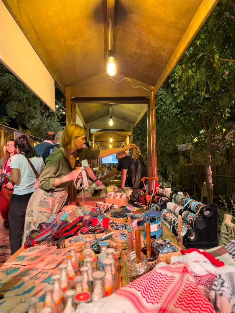 Travellers gathered at a colourful evening market during the G Adventures GX community event in Amman, Jordan