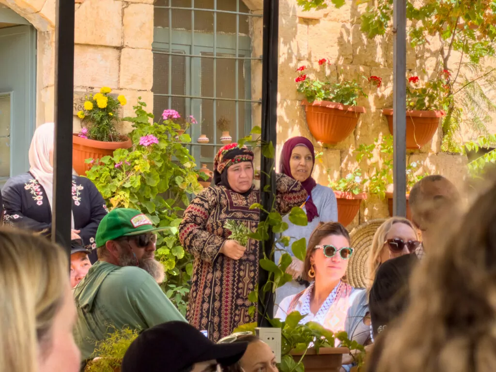 Travellers sharing a meal at Beit Khayrat Souf, a Planeterra-supported community project in Jordan