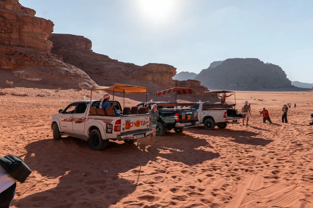 4WD vehicles parked in the desert at a camp in Wadi Rum, Jordan