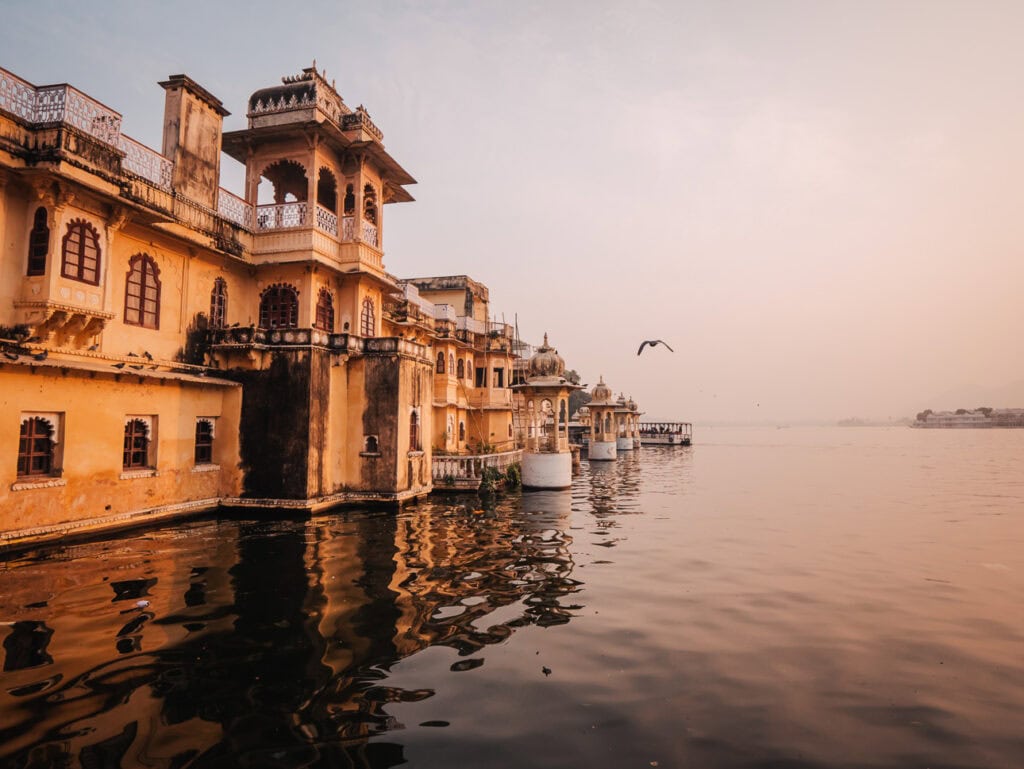 Lal Ghat in Udaipur with steps leading down to Lake Pichola and historic buildings along the waterfront