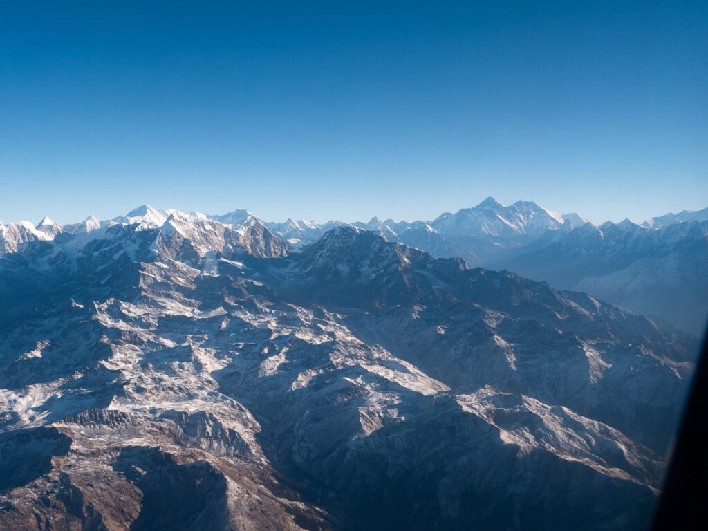 Close-up aerial view of rugged Himalayan ridges and glaciers from a scenic flight