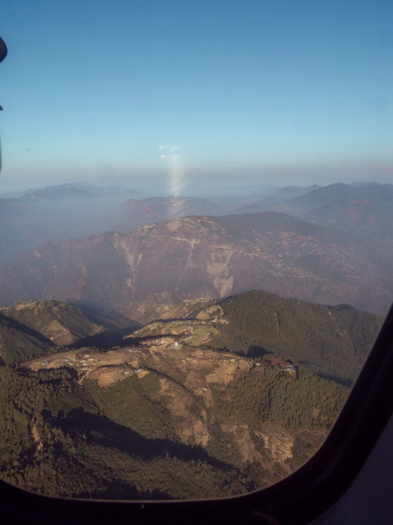 View from inside a plane during a scenic Everest flight over the Himalayas