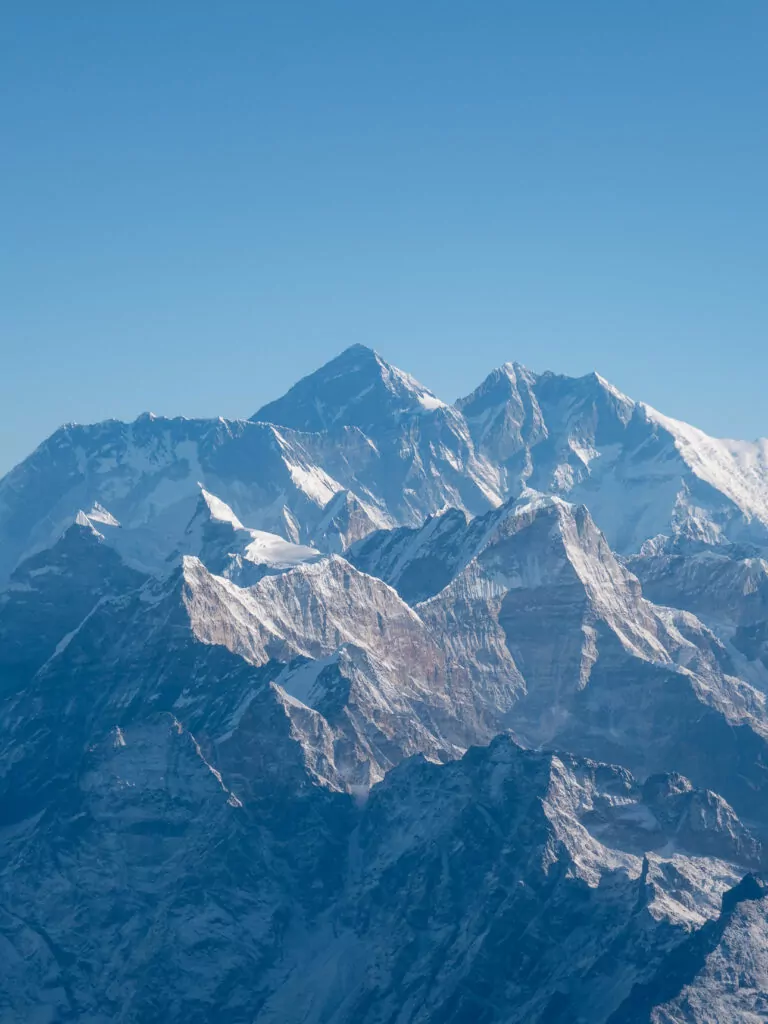 Snow-covered peak of Mount Everest seen from a scenic flight over the Himalayas