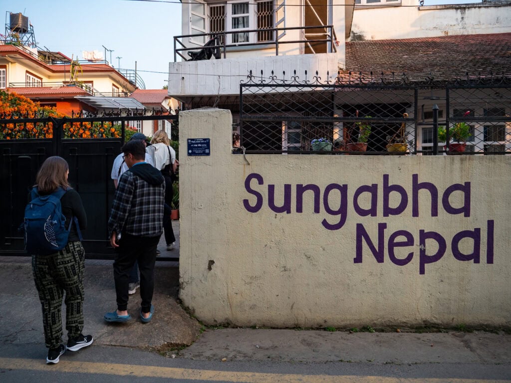 Entrance to Sungabha Seven Sisters with the name painted on the wall outside
