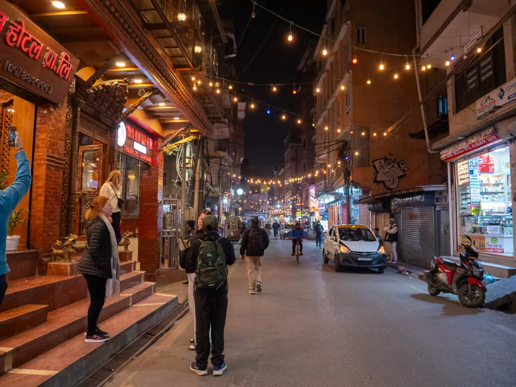 Fairy-lit streets of Thamel in Kathmandu at night with shops and restaurants
