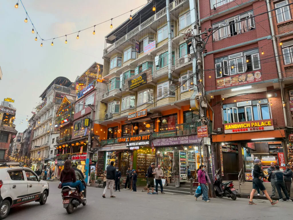 Busy street lined with multi-storey buildings and shopfronts in Thamel, Kathmandu