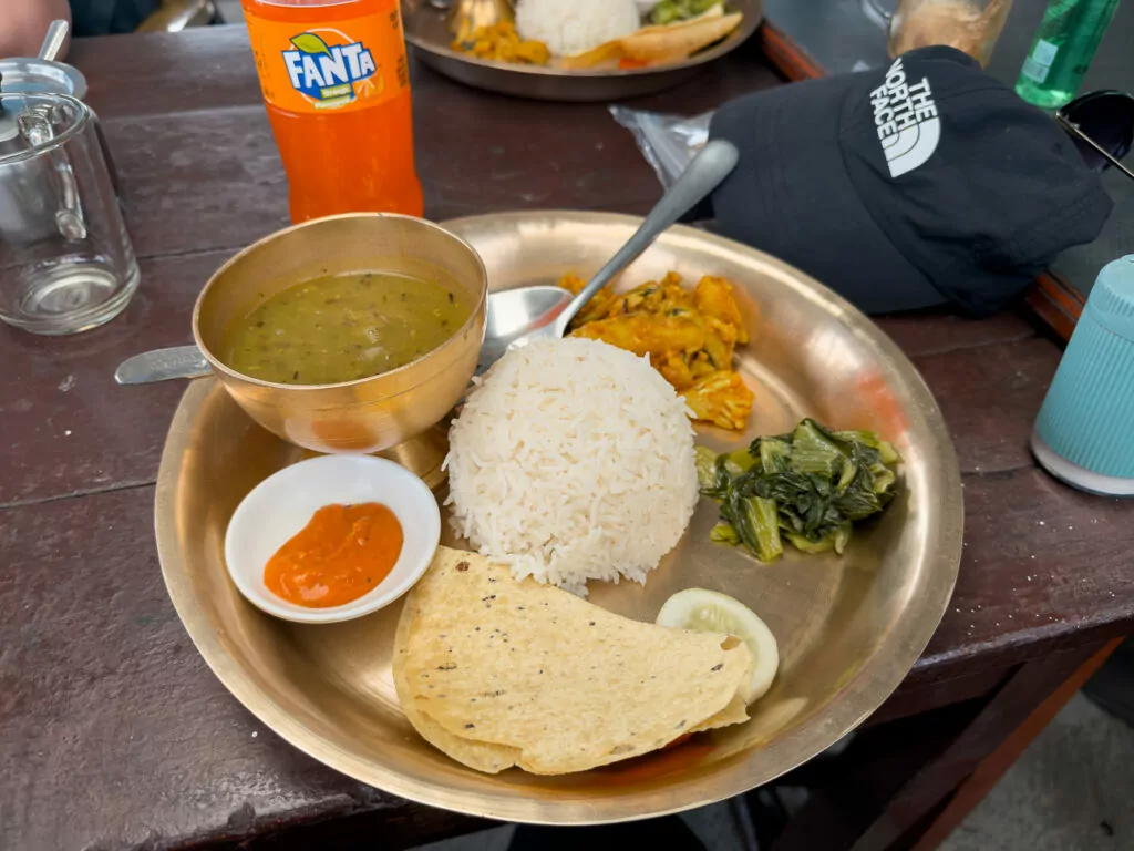 Traditional Nepali dal bhat thali served at a teahouse during the Australian Camp trek