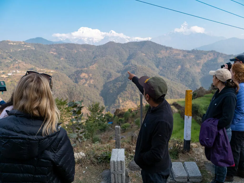 Snow-capped Himalayan peaks visible above the clouds from the Australian Camp trek near Pokhara