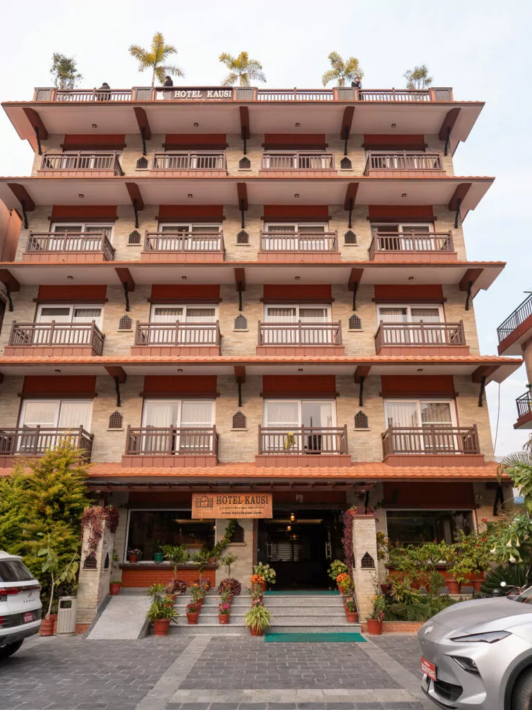 Exterior of Hotel Kausi in Pokhara, a multi-storey building on a quiet street