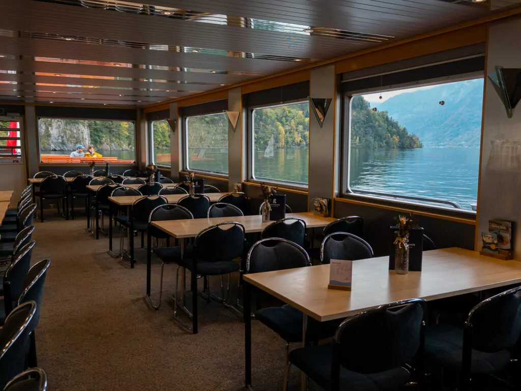 The 2nd class restaurant on board a Lake Lucerne boat with lakeview windows and empty dining tables