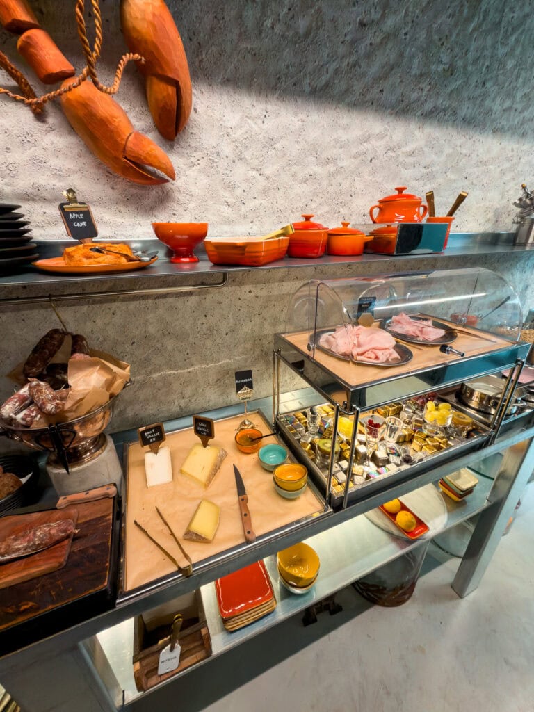 A generous breakfast spread at B5 Boutique Hotel in Lugano featuring locally-sourced cured meats, cheeses and fresh pastries