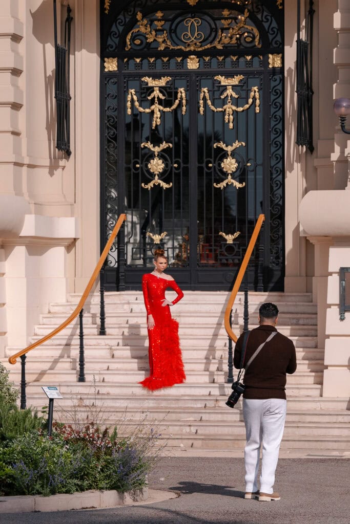 Luxury cars and tourists fill the square outside Monte Carlo Casino. The scene captures Monaco glamour on an easy French Riviera day trip