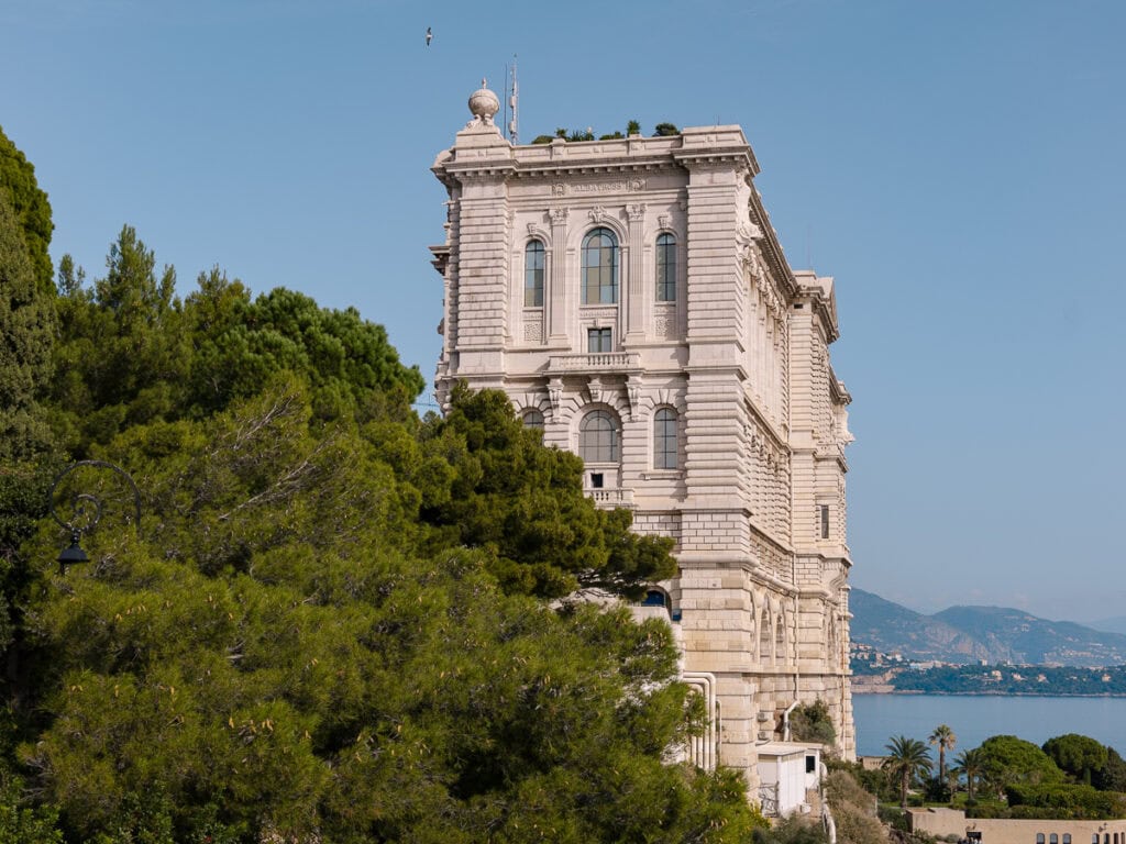 The Oceanographic Museum in Monaco stands on a cliff above trees and sea. It is one of the major Monaco sights that can be reached without renting a car
