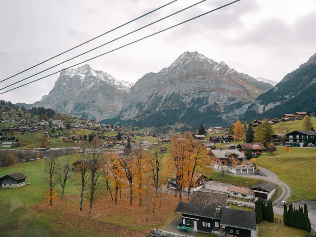 Grindelwald village and surrounding mountains seen from a moving cable car