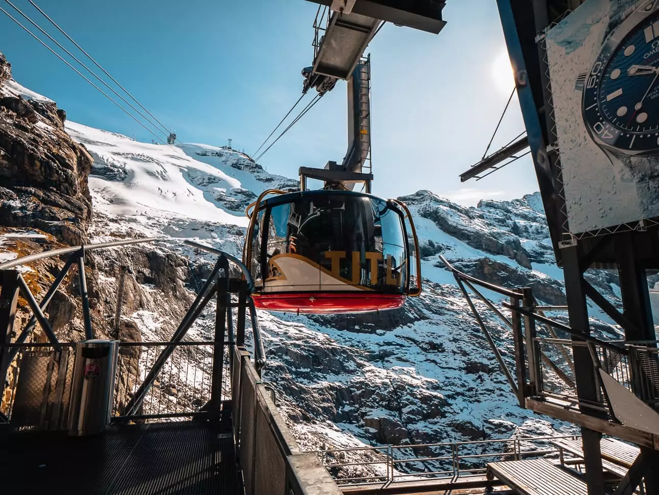 Titlis cable car above snowy peaks and Lake Trübsee near Engelberg