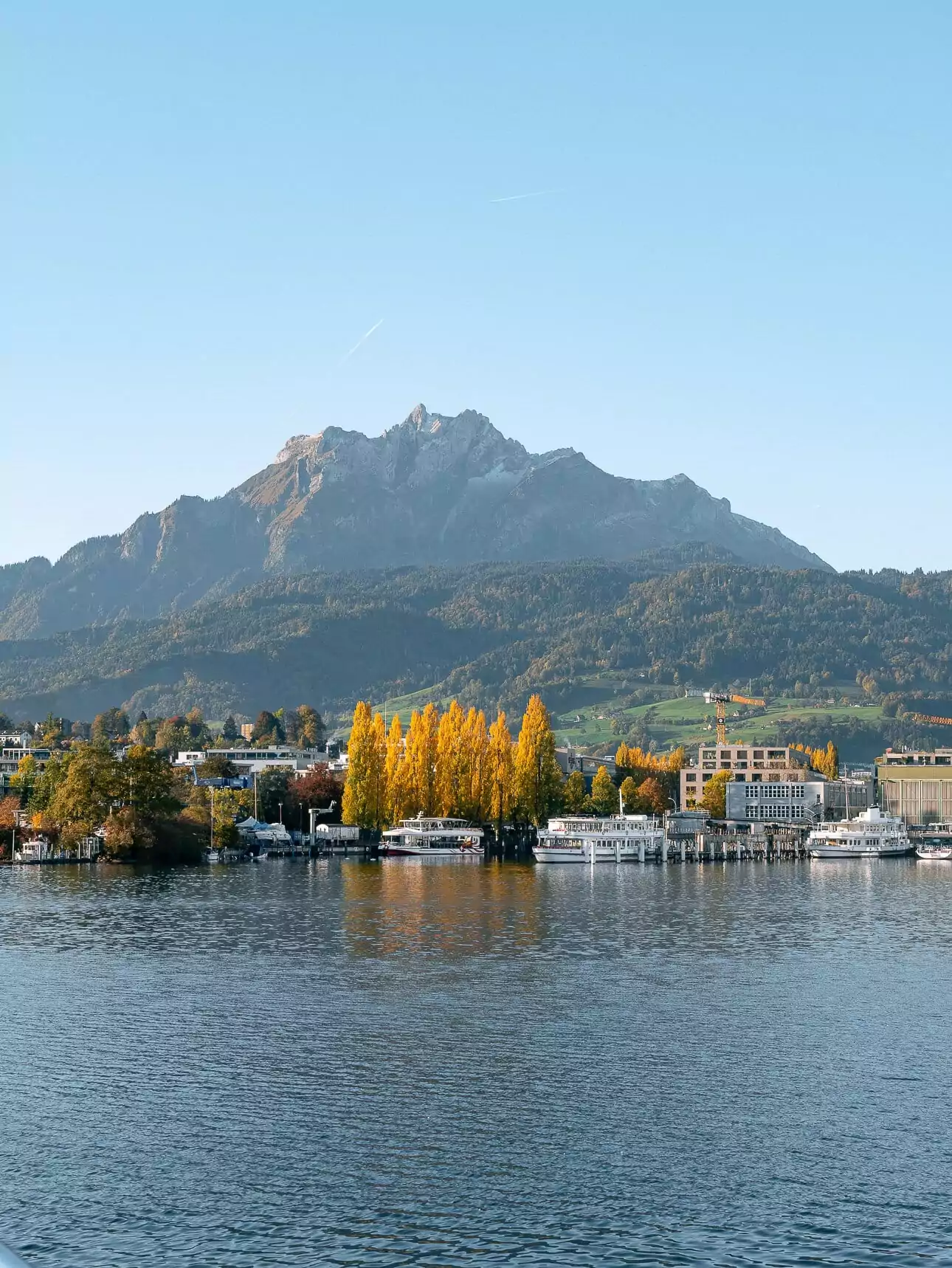 Lake Lucerne waterfront with Mount Pilatus in the background during autumn