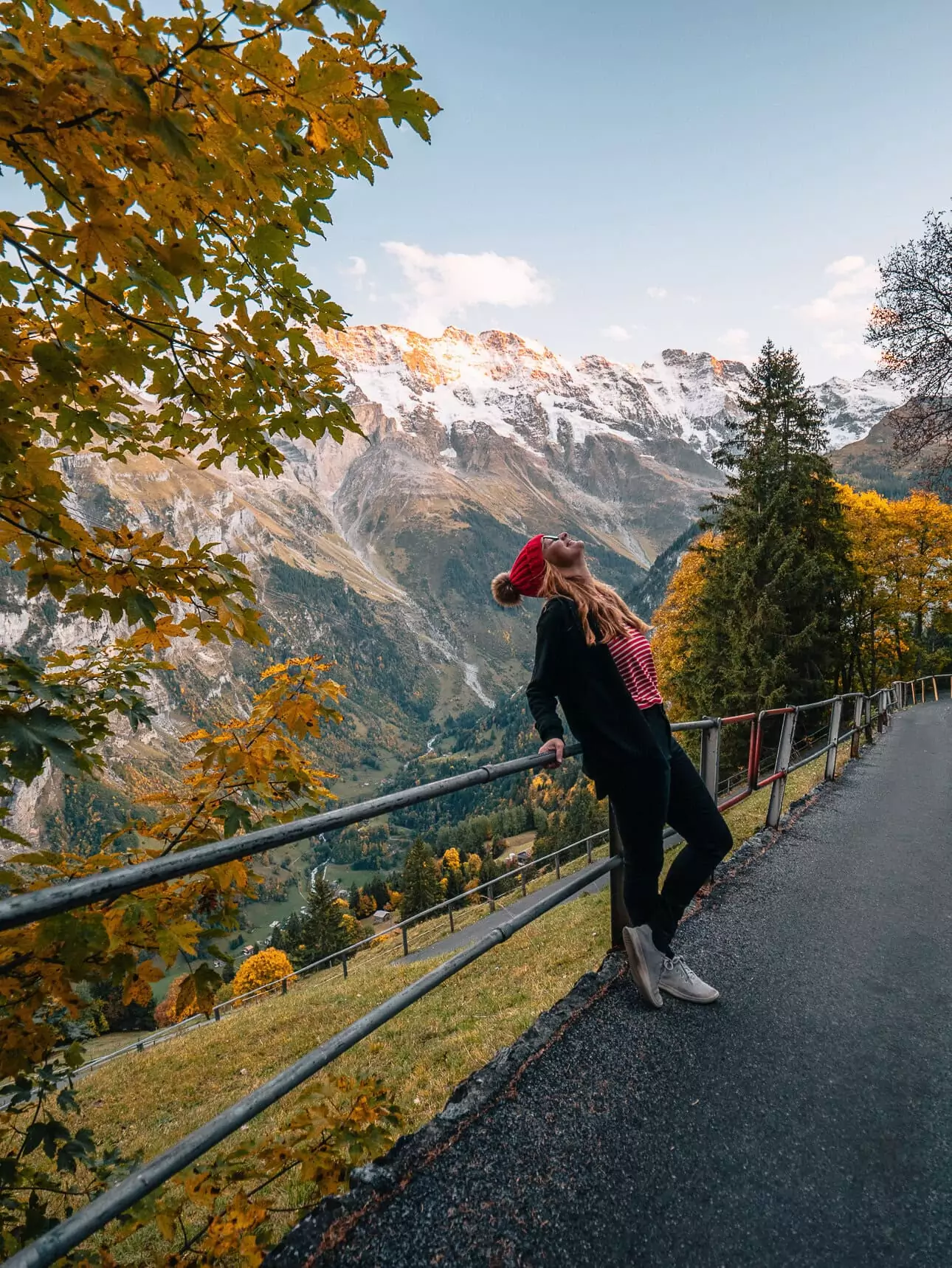 Traveller overlooking the mountains from Mürren in autumn