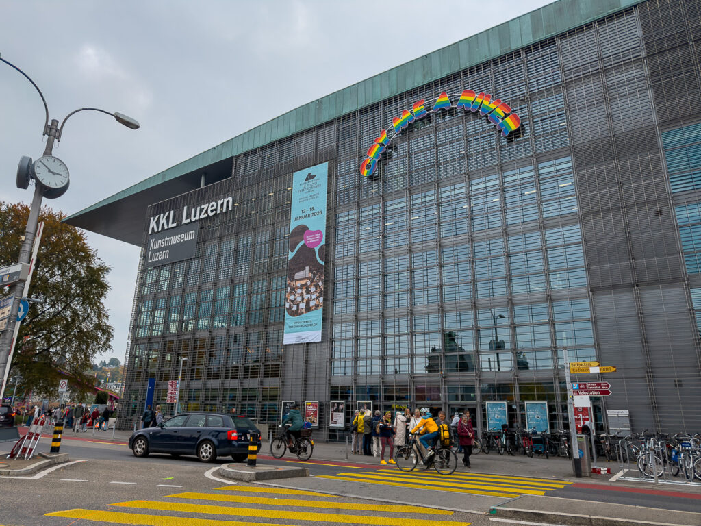 The KKL Luzern concert hall by the station, a glass building under a wide overhanging roof