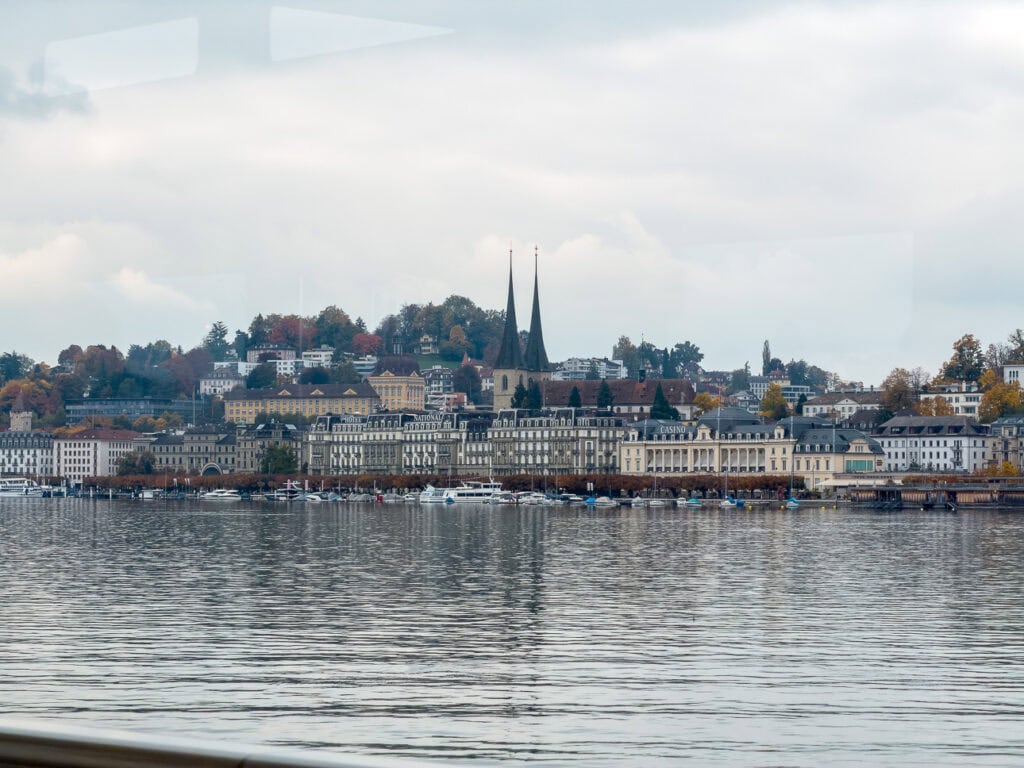 Lucerne's row of lakefront hotels seen from the water, the best area to stay in Lucerne for lake views
